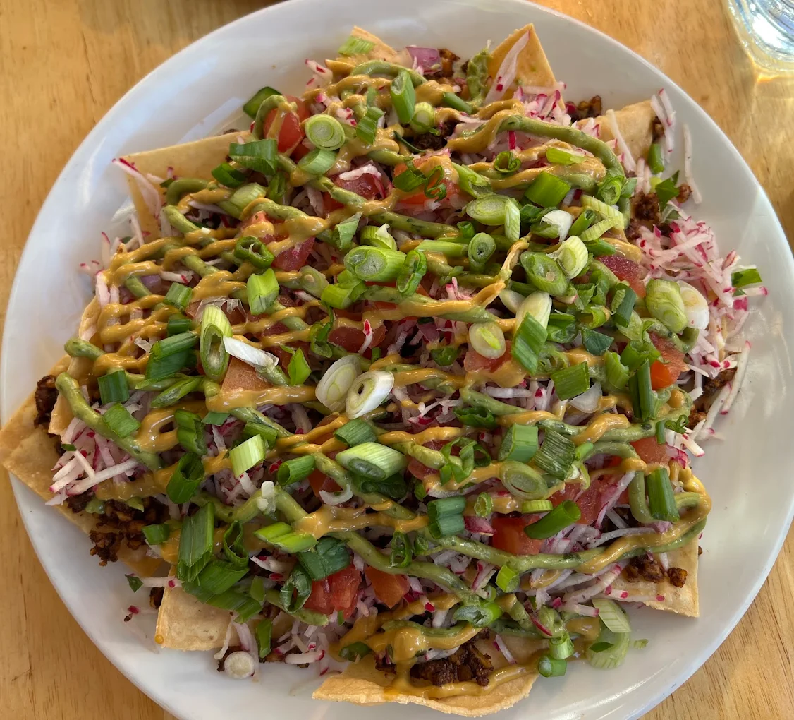 Poco Nachos · avocado crema, radish